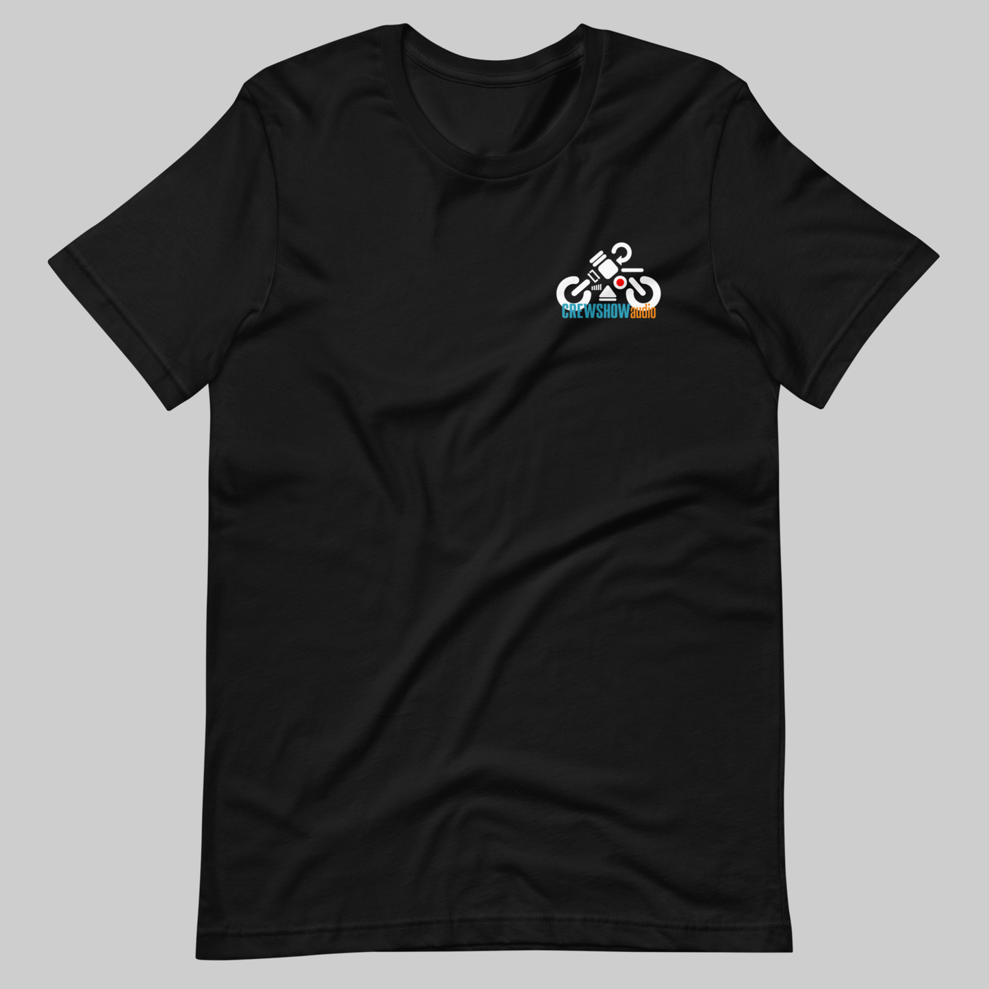 Audi Icons Biker graphic T-shirt. Front view of a open black t-shirt with a small graphic of a motorbike made up of audio control symbols, on the left breast pocket.