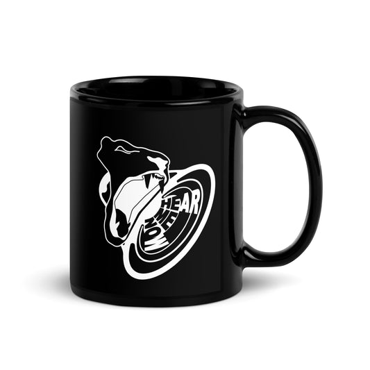 Hear Me Now King of Beasts glossy black mug. Side view of black mug with the handle to the right. On the mug is a graphic of a roaring lion with the words Hear Me Now.