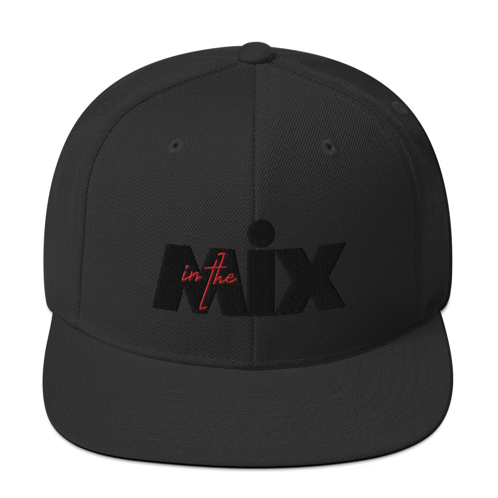 In The Mix embroidered snapback cap. Front view of black cap with embroidered text that says MIX.