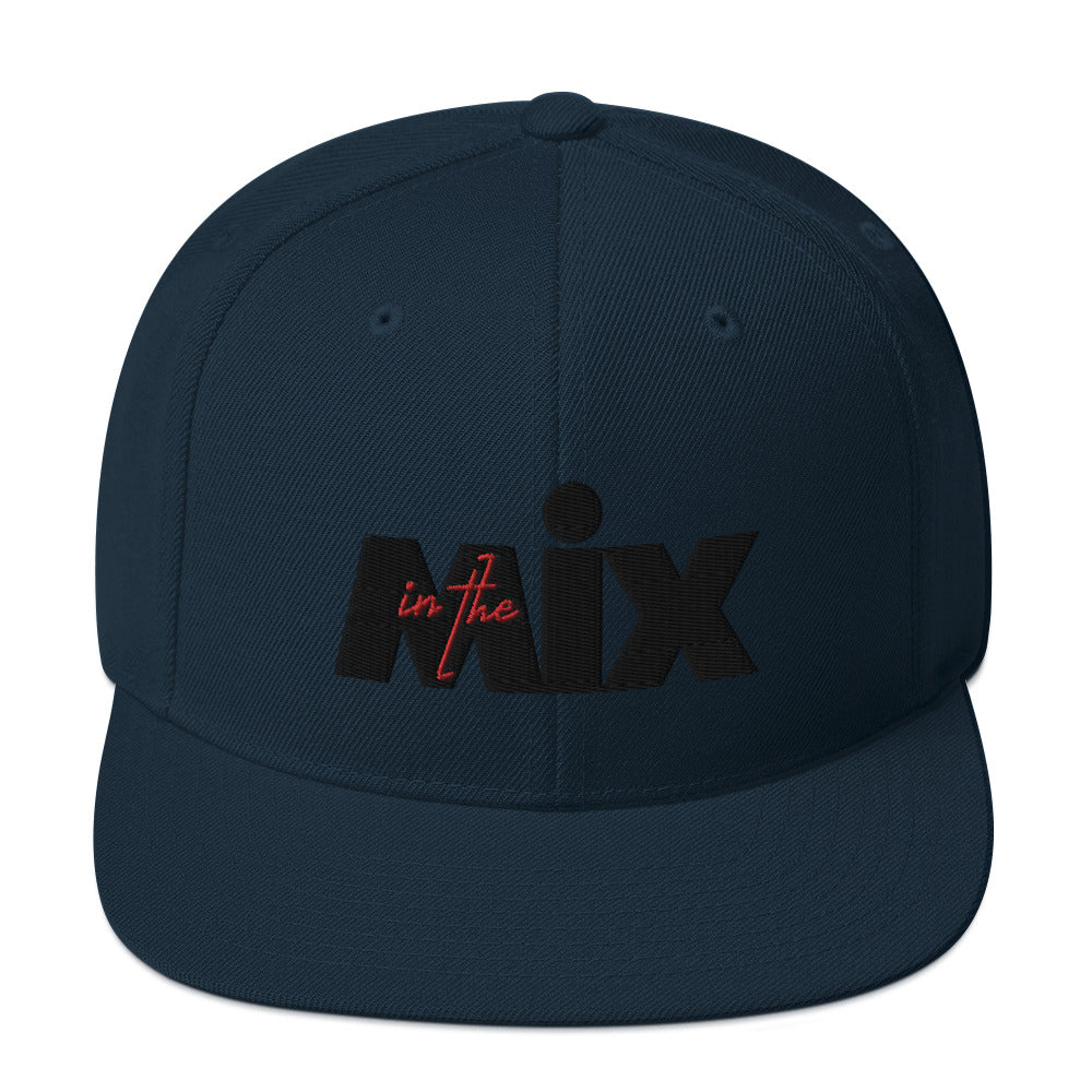 In The Mix embroidered snapback cap. Front view of dark navy cap with embroidered text that says MIX.