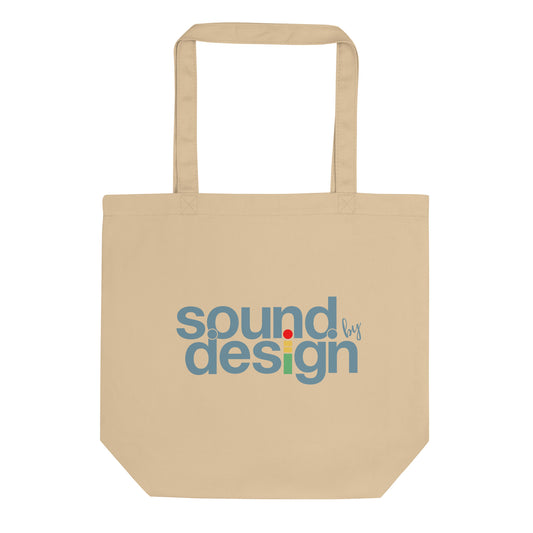 iMeter Sound by Design graphic tote bag. Front view of an oyster colour tote bag with a graphic that says Sound by Design.