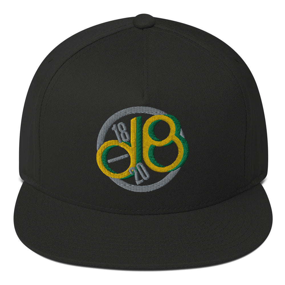 Line Up Tone classic snapback cap. Close up front view of black cap with an embroidered graphic of the letters d & b.