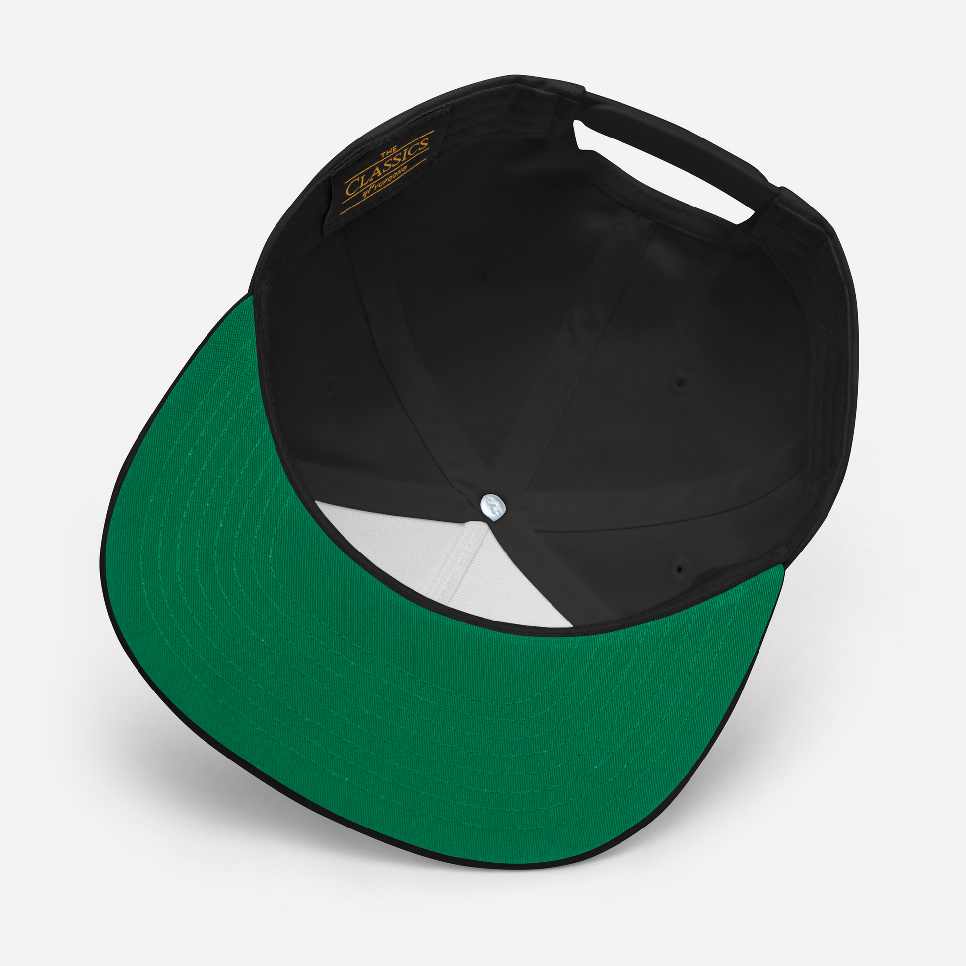 Art Form Red, Boom operator, Snapback cap. Underside view of black cap with green colour undervisor