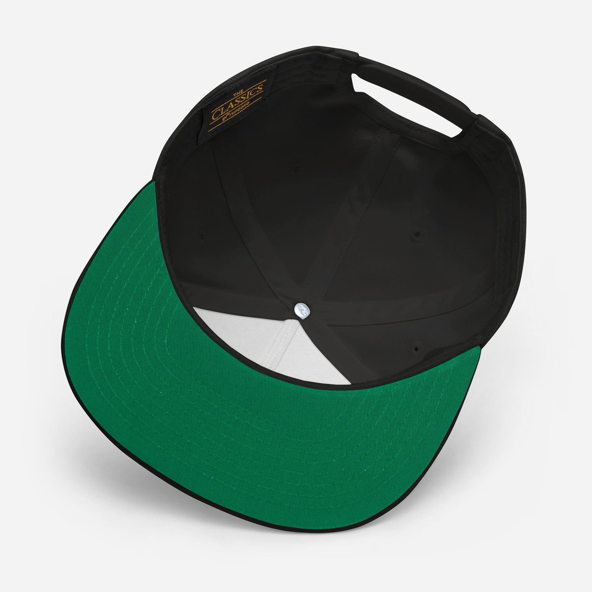 Line Up Tone classic snapback cap. Close up underside view of black cap.