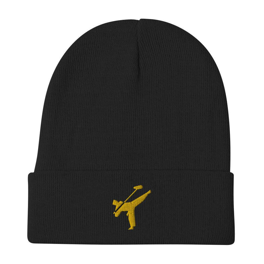 Art Form Gold boom op icon embroidered beanie. Front view of a black beanie with an embroidered graphic of a martial arts fighter.