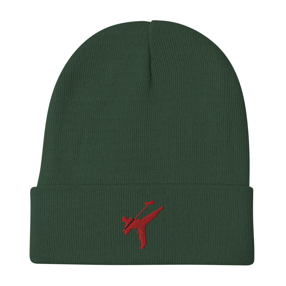 Art Form Red boom op icon embroidered beanie. Front view of a green beanie with an embroidered red graphic of a martial arts fighter.