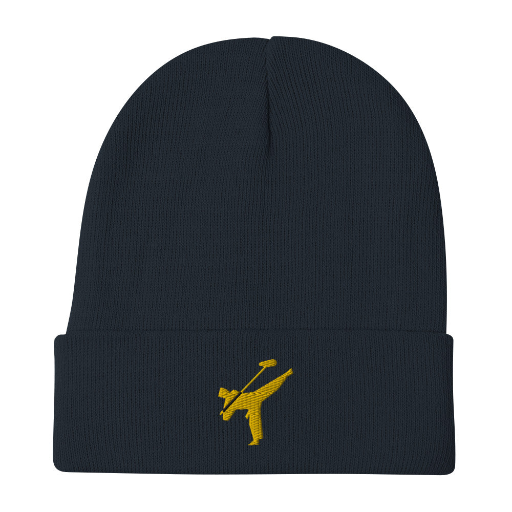 Art Form Gold boom op icon embroidered beanie. Front view of a navy blue beanie with an embroidered graphic of a martial arts fighter.