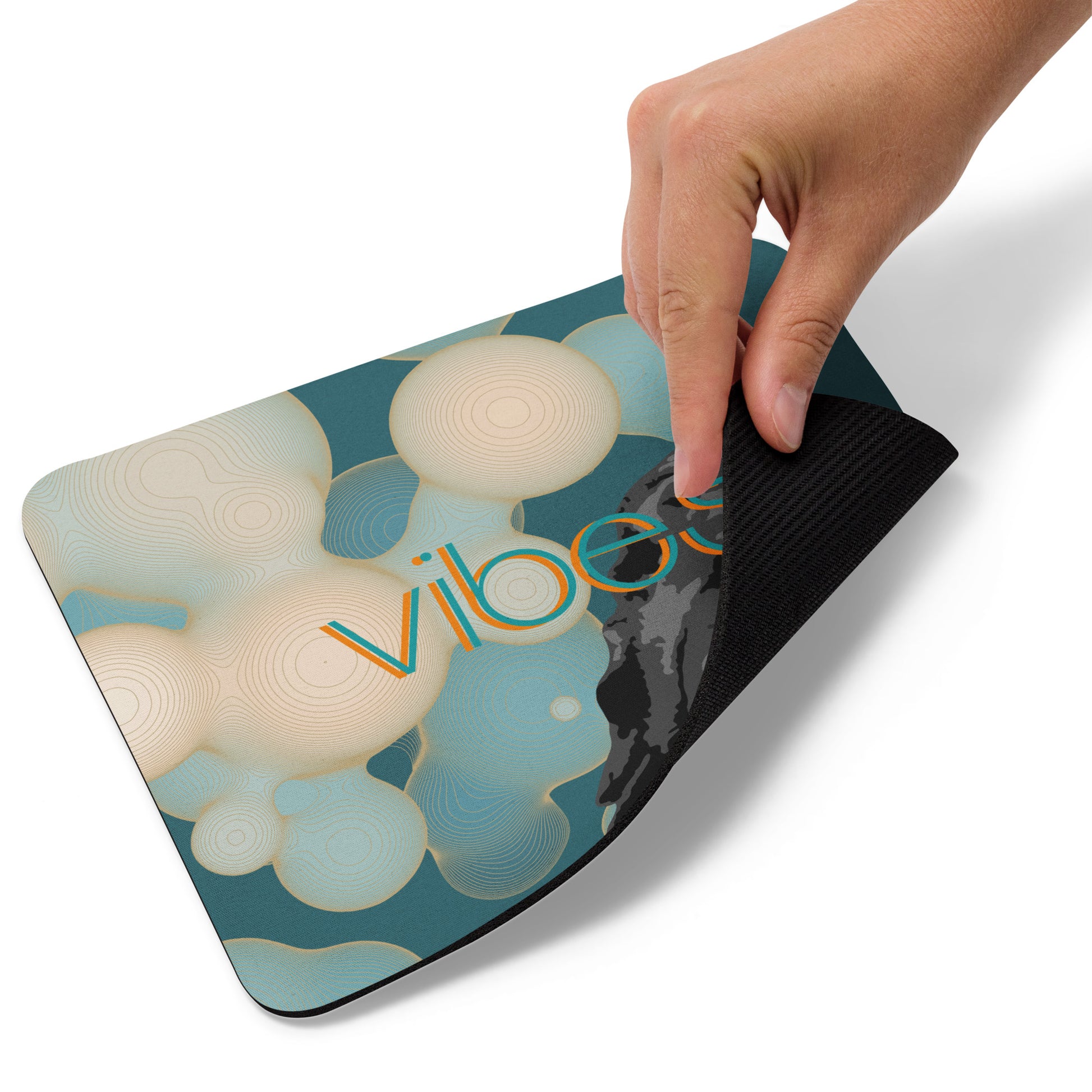 Vibes Easy Listening mouse pad. Front view of a mouse pad with a hand turning one corner upwards.