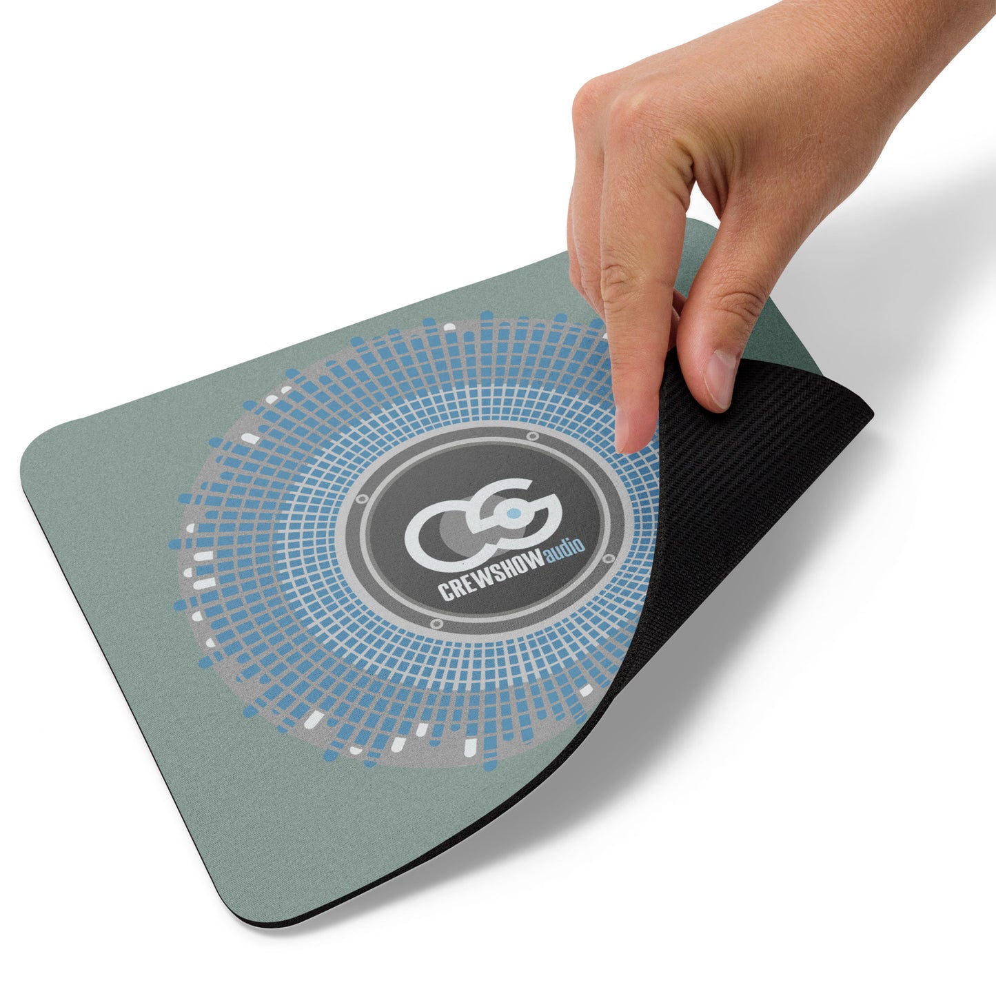 Bass Driver Sound Explosion mouse pad. Front view of a mouse pad with a graphic of a loudspeaker cone, with a hand turning up one corner.