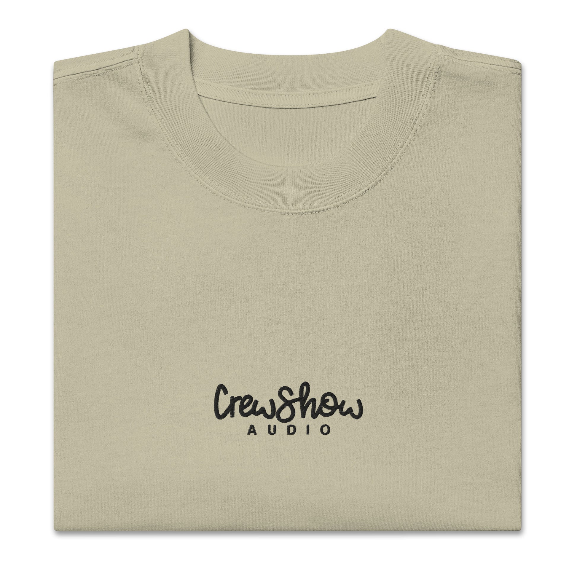 Crew Show Flow Script Style embroidered t-shirt. Front view of folded eucalyptus coloured t-shirt which has Crew Show Audio embroidered on it.