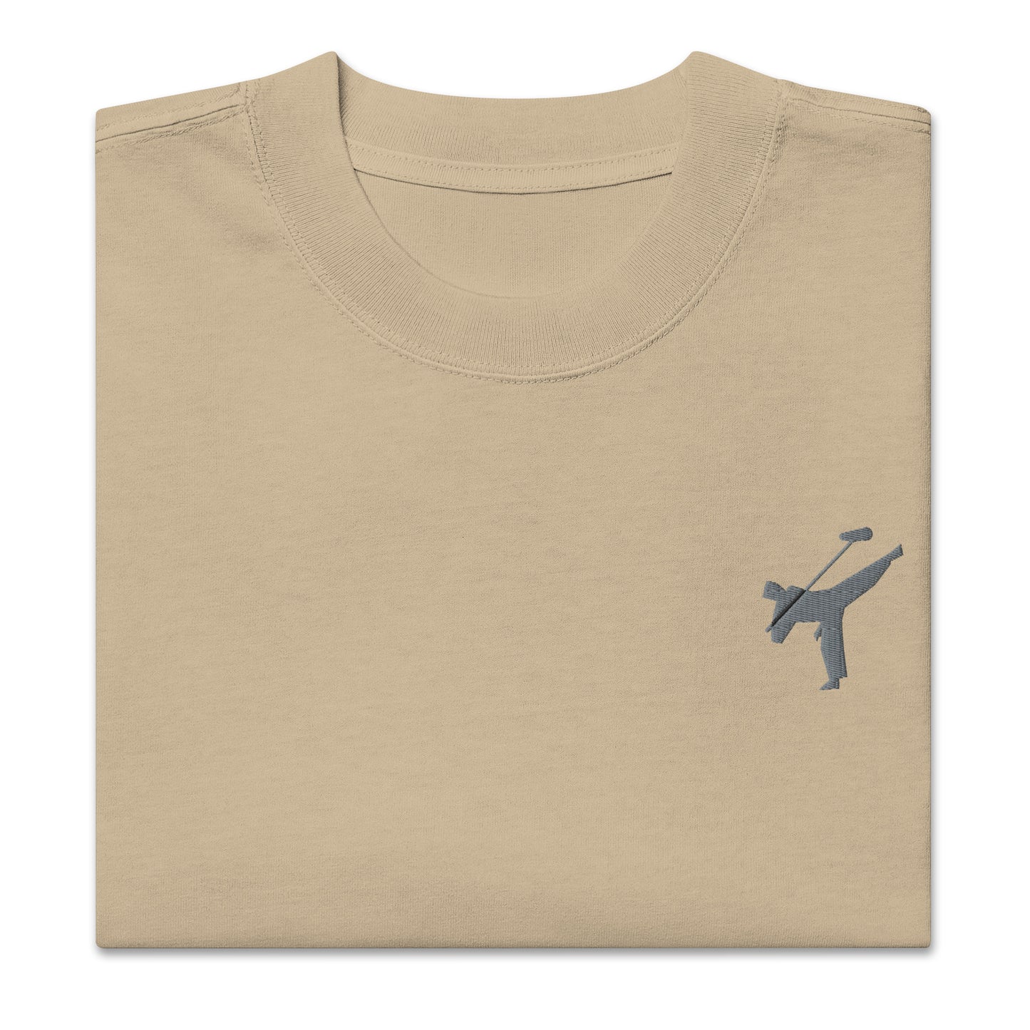 Art Form Boom Icon embroidered T-shirt, close up front view of folded khaki colour t-shirt with an embroidered martial arts boom operator in the top left.