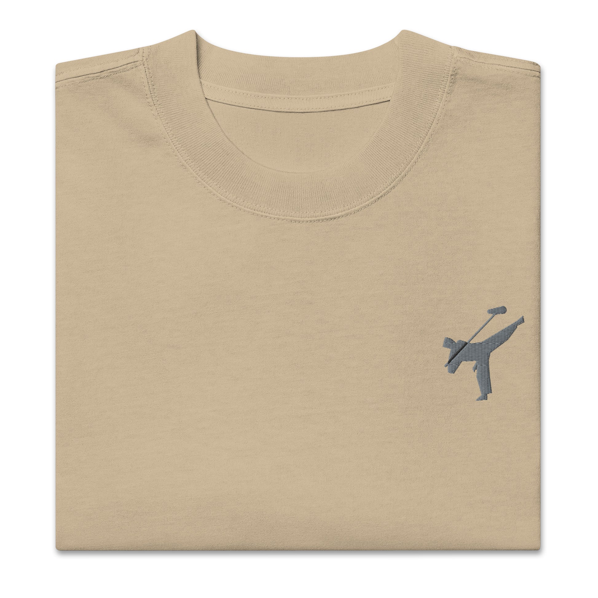 Art Form Boom Icon embroidered T-shirt, close up front view of folded khaki colour t-shirt with an embroidered martial arts boom operator in the top left.