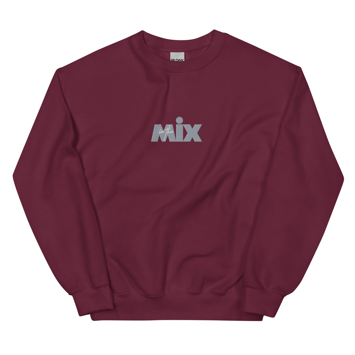 In The Mix embroidered sweatshirt. Front view of a maroon colour sweatshirt with an embroidered text graphic that says MIX.