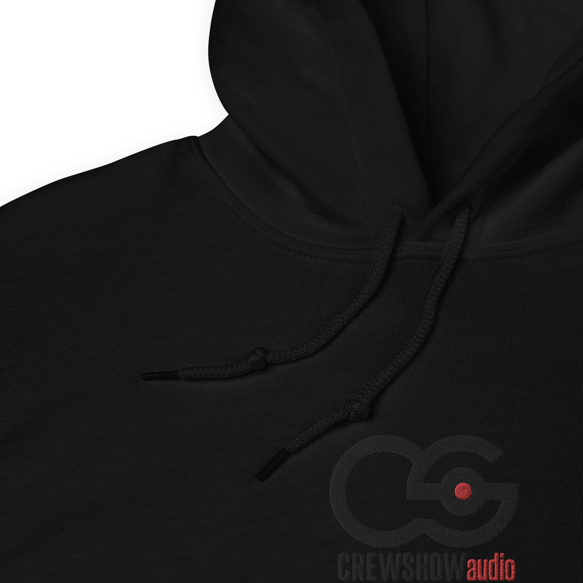 Crew Show Audio unisex embroidered hoodie. Close up front view of black hoodie with the Crew Show Audio logo embroidered on the front.