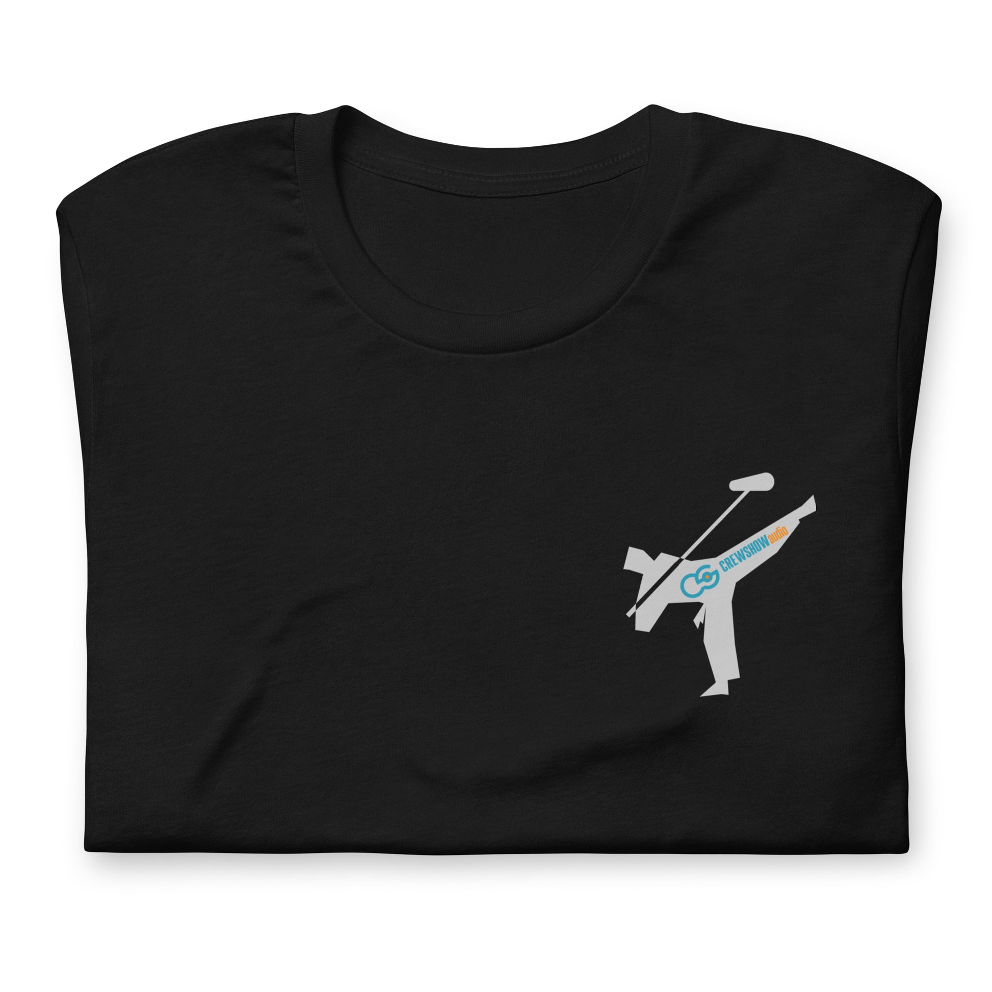 Active Duty Sound Crew graphic T-shirt. Front view close up of folded black T-shirt with a graphic of martial arts fighter holding a boom microphone