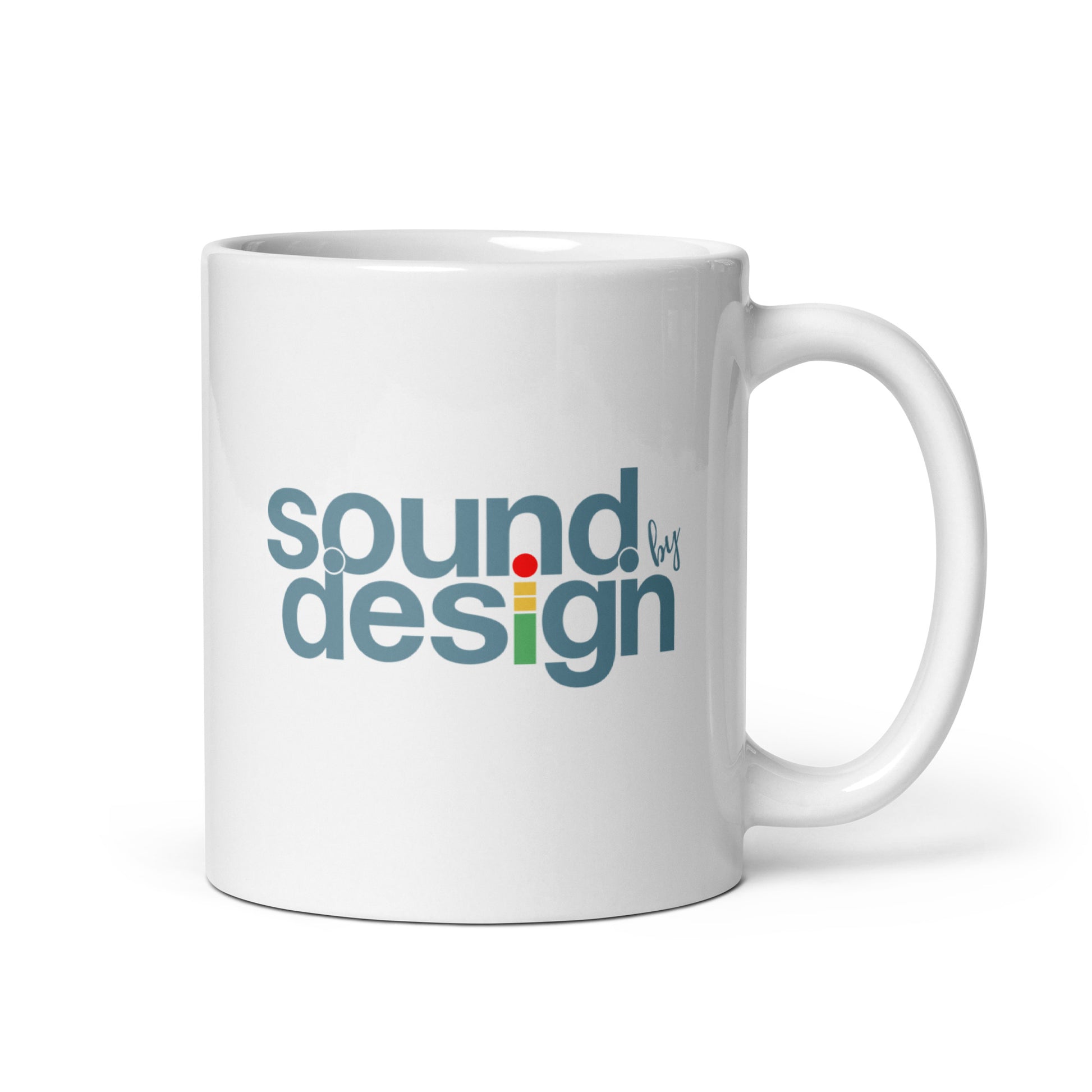 Sound by Design glossy white mug. Side view of white mug with the handle to the right. On the mug is a text graphic that says Sound by Design.